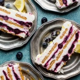 slices of blueberry lemon icebox cake on silver plates