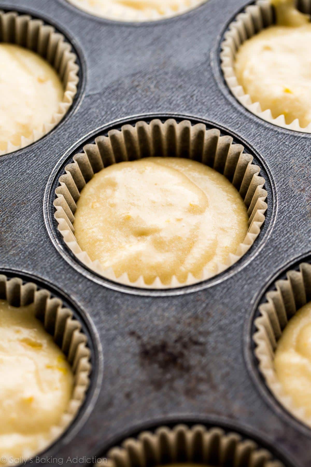 lemon cupcake batter in a cupcake pan