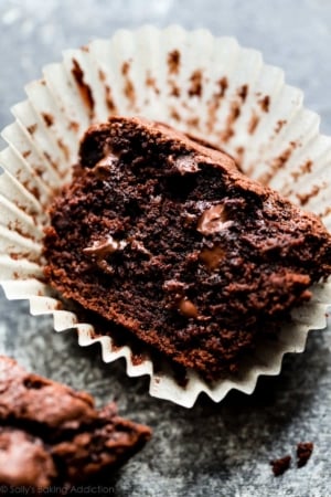 triple chocolate muffin cut in half in a muffin liner