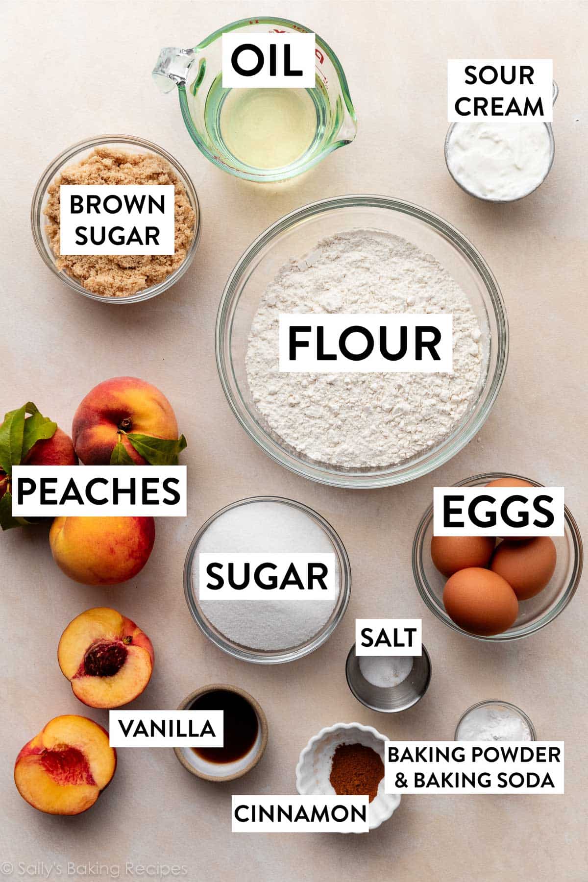 ingredients on peach backdrop including flour, eggs, salt, sugar, oil, brown sugar, cinnamon, and sour cream.