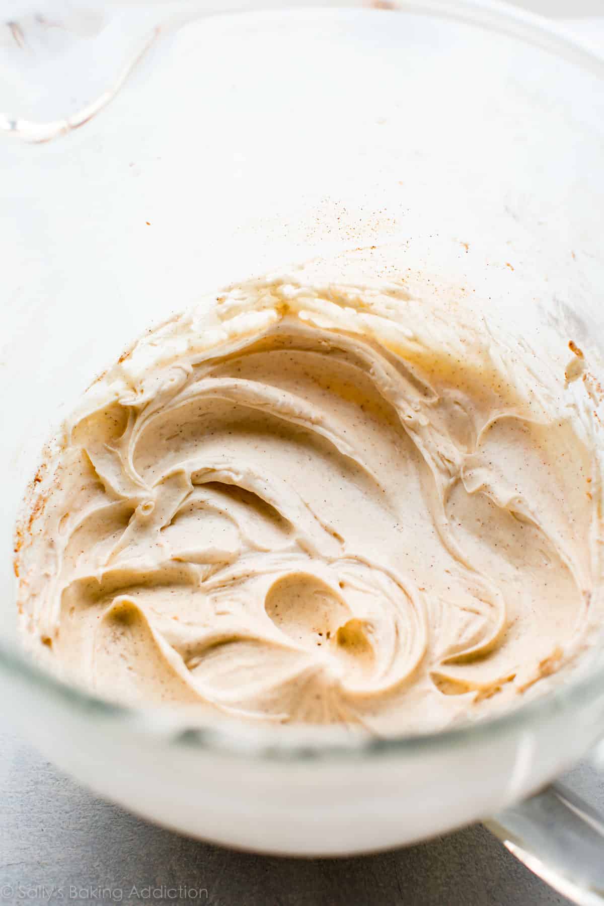 Cinnamon cream cheese frosting in mixing bowl