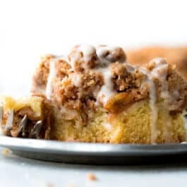 slice of apple crumb cake on a silver plate