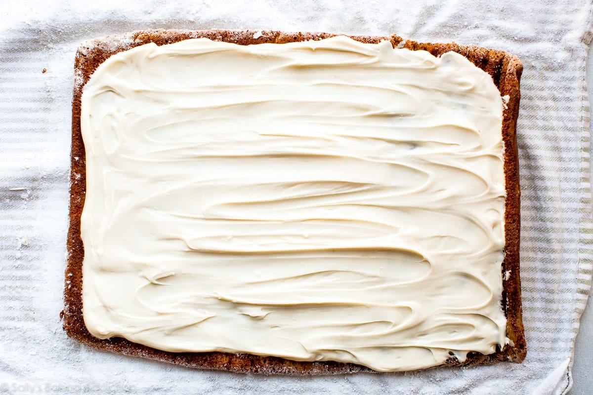 Cream cheese frosting on pumpkin roll cake