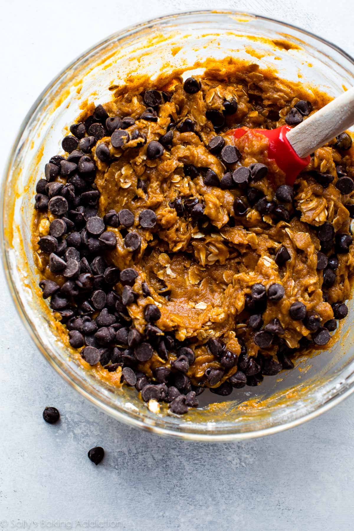 pumpkin oatmeal chocolate chip cookie dough in a glass bowl