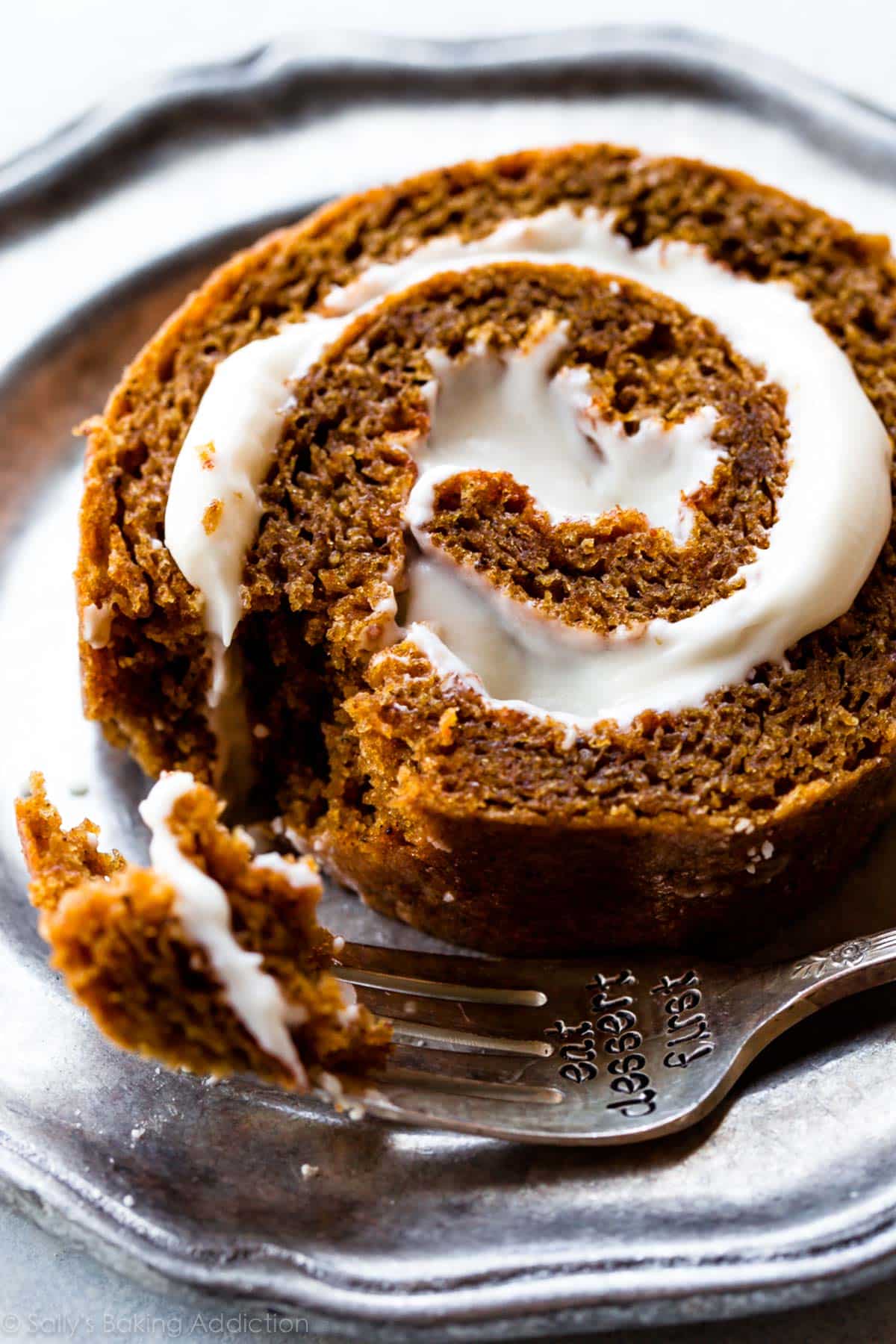 slice of pumpkin roll on a silver plate