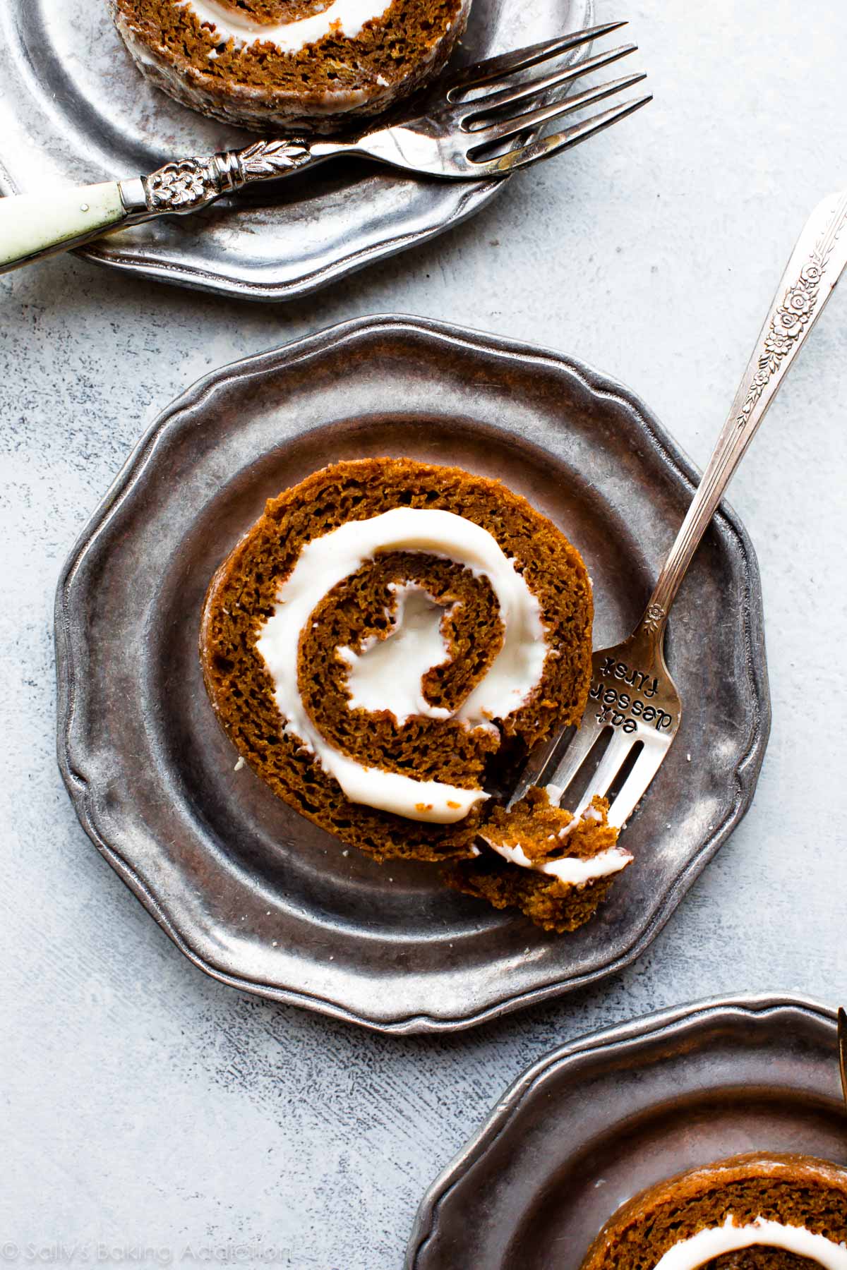 slice of pumpkin roll on silver plates