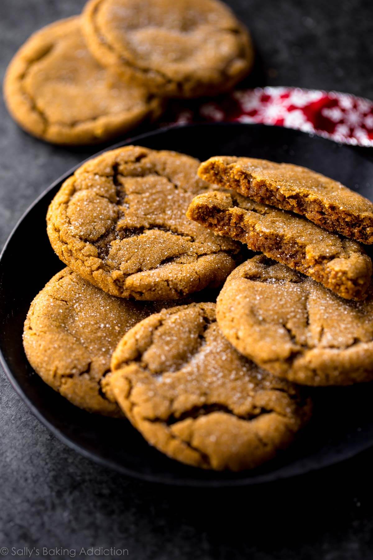 molasses cookies on a black plate