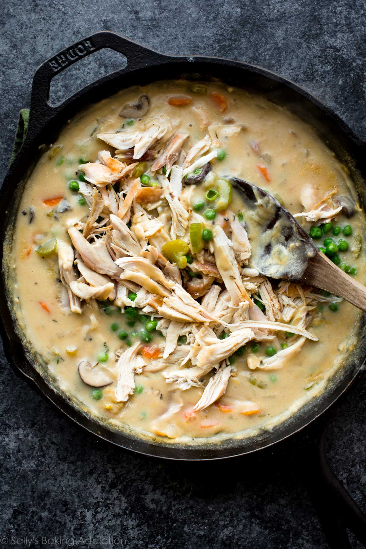 vegetables and turkey in a skillet with gravy