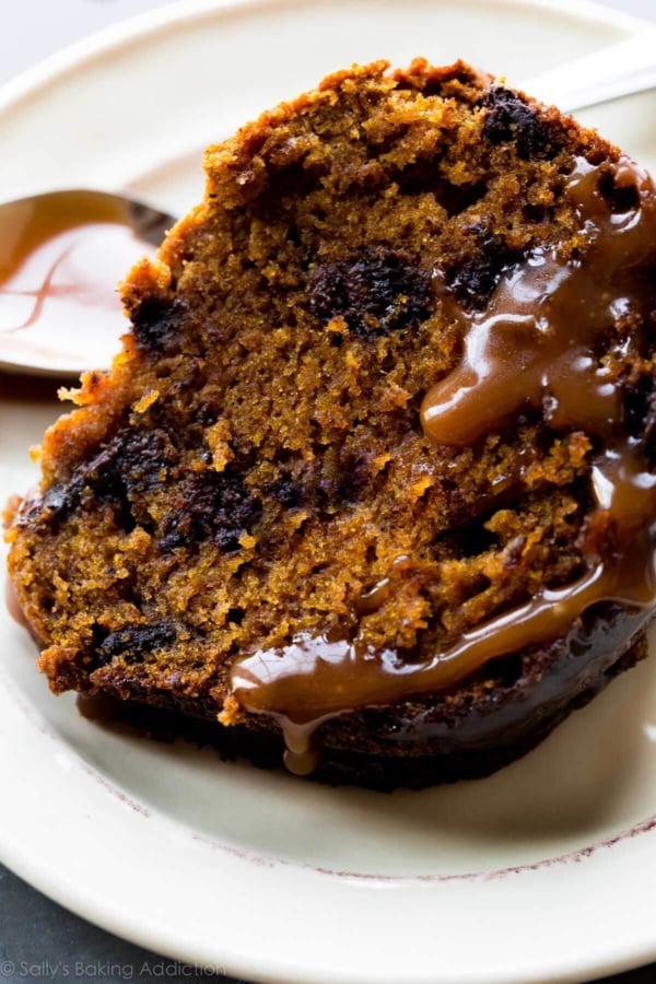 slice of pumpkin bundt cake on a cream plate