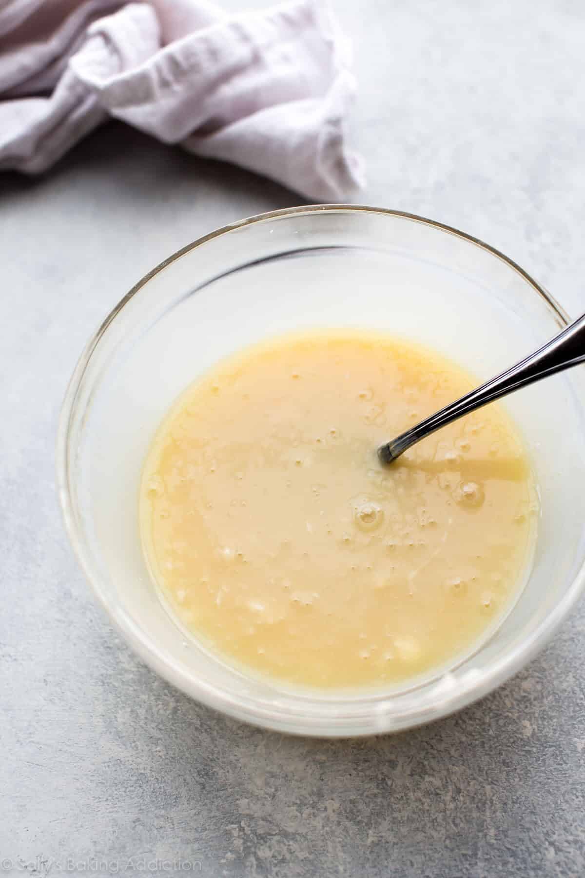 white chocolate ganache in a glass bowl