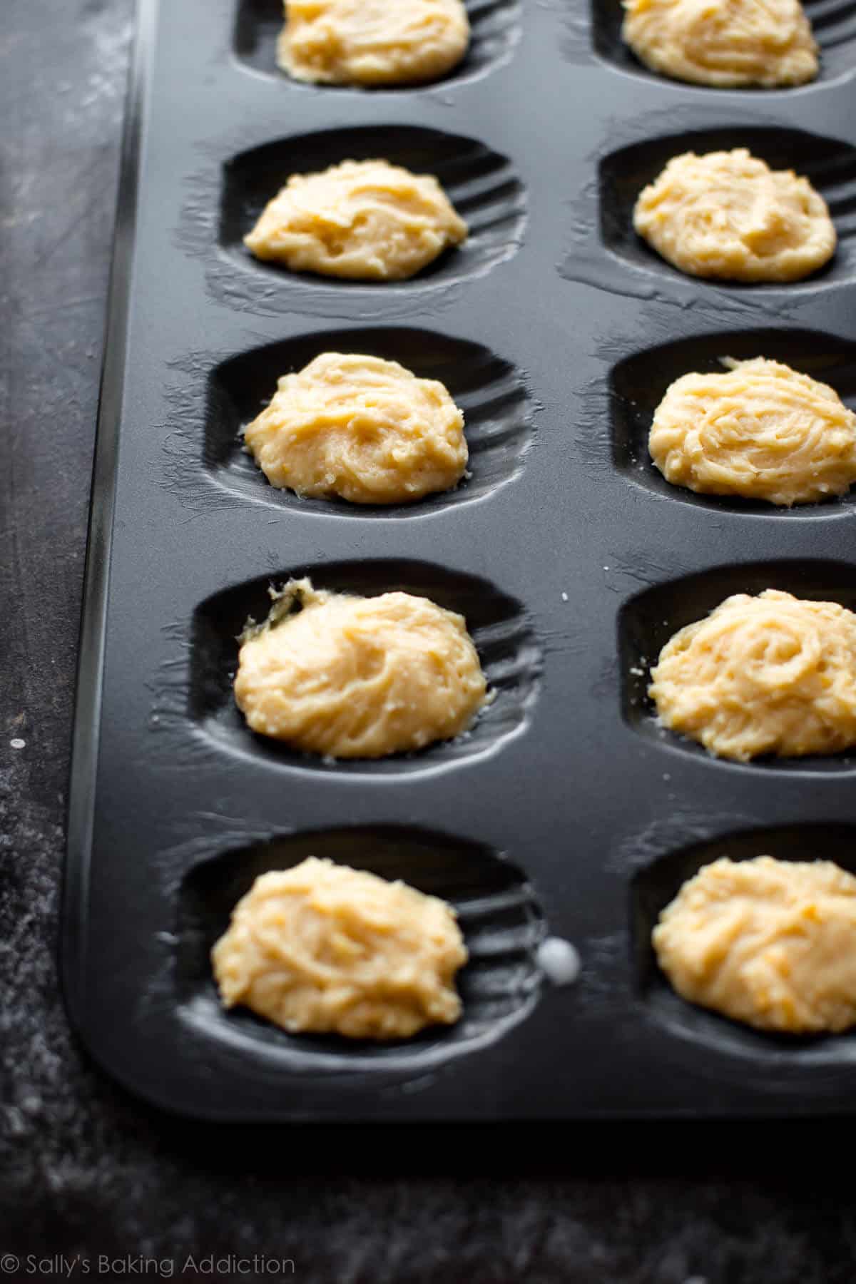 madeleine batter in madeleine pan before baking