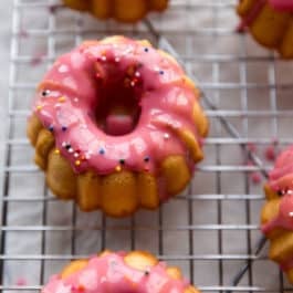 Mini pound cakes with raspberry icing and sprinkles