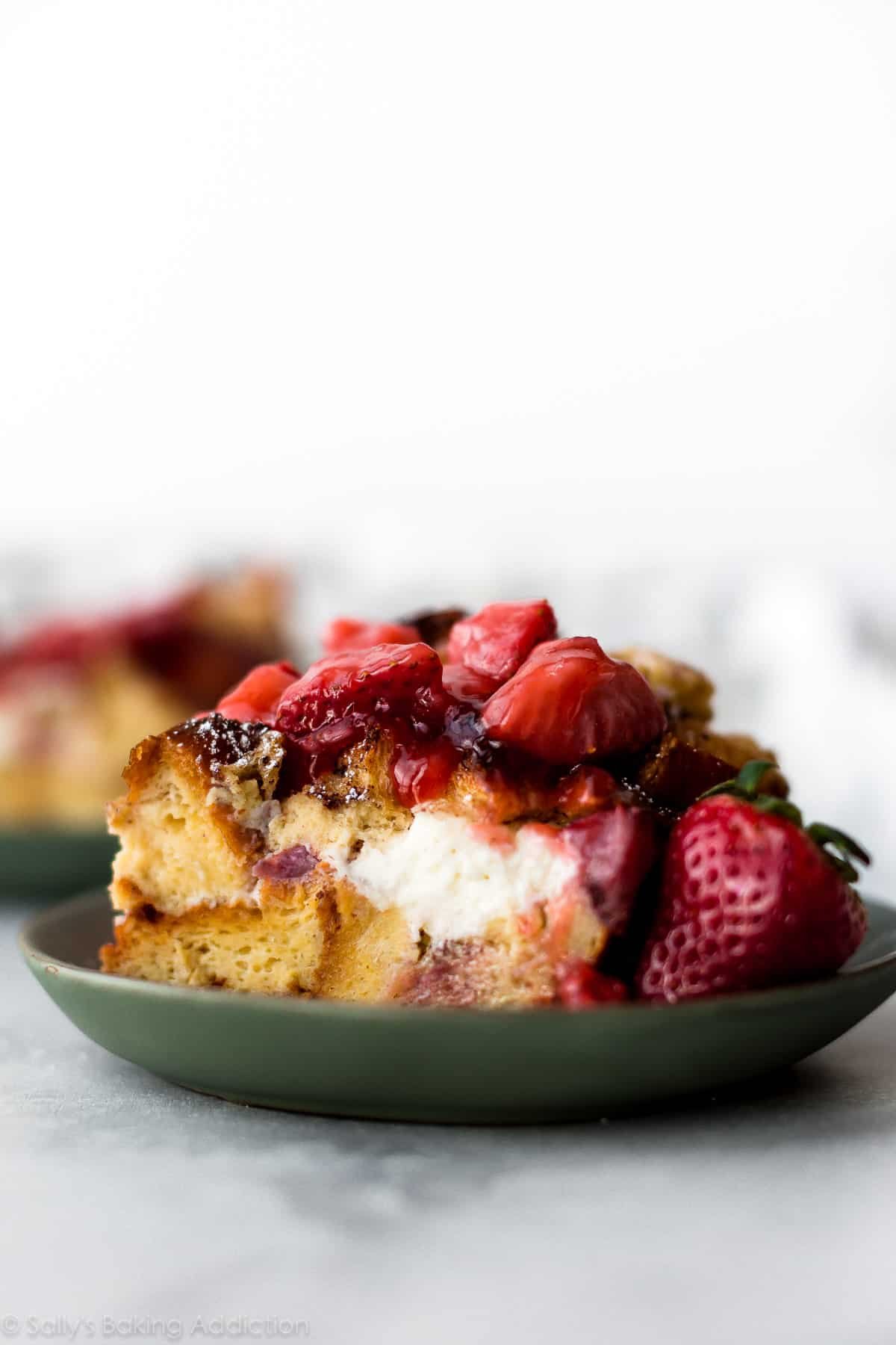 slice of strawberry cream cheese French toast bake on green plate