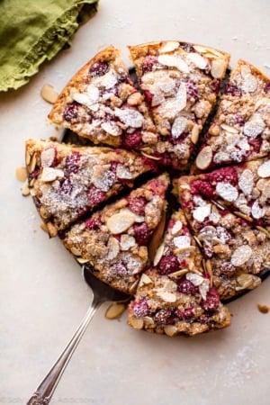 overhead image of sliced raspberry almond crumb cake