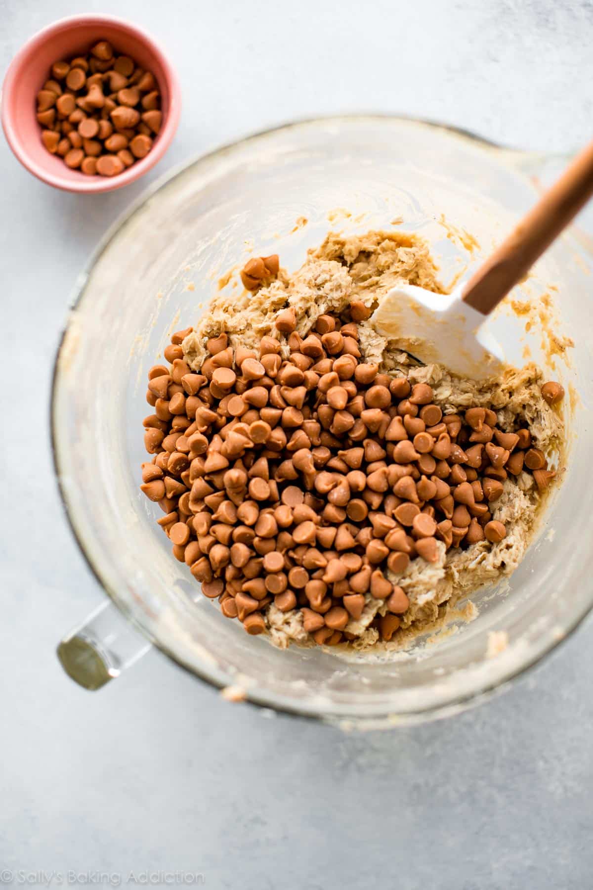 oatmeal scotchies cookie dough in a glass bowl