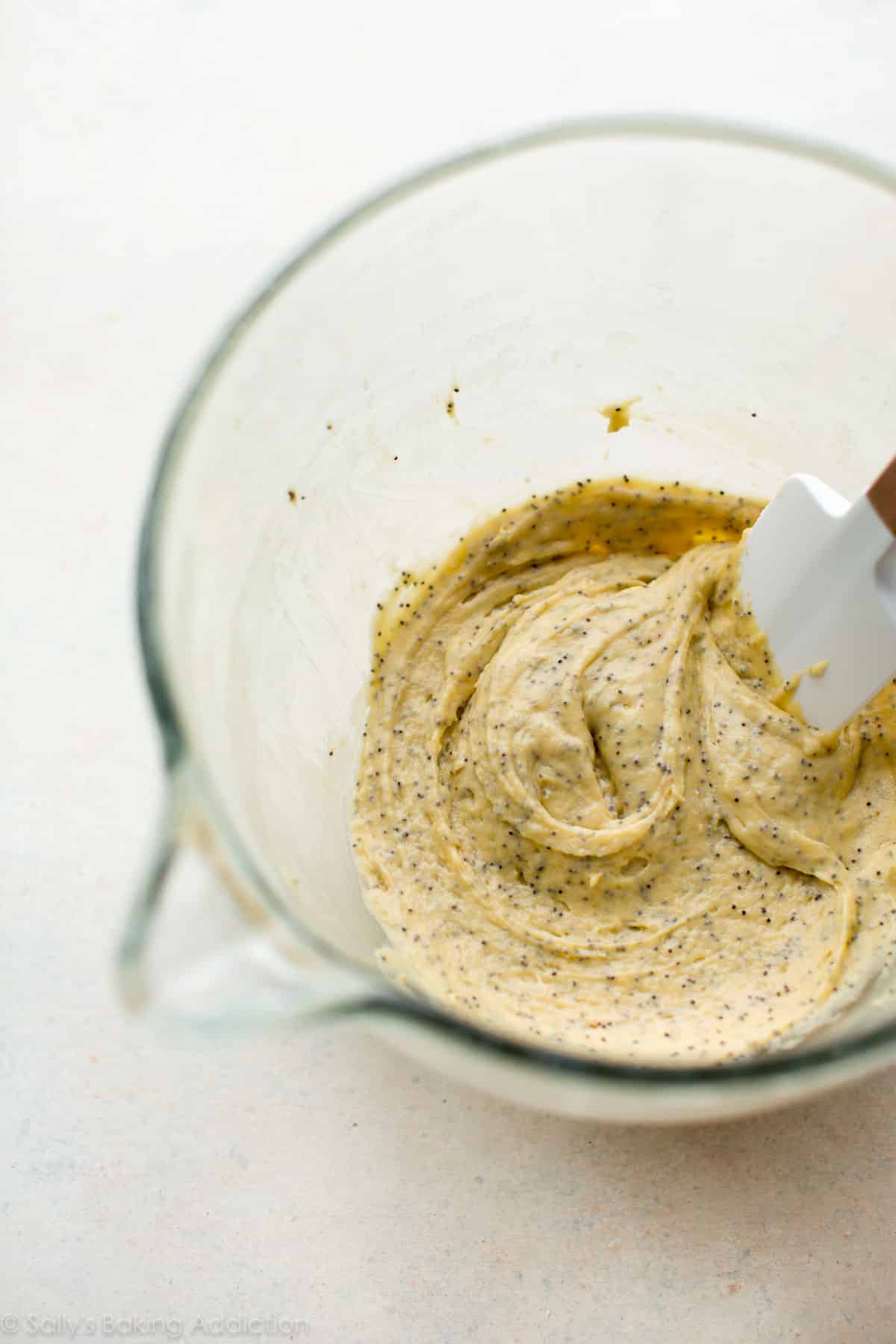 almond poppy seed tea cake batter in a glass bowl