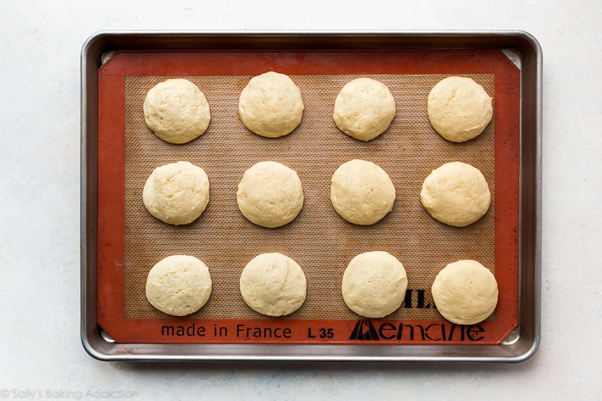 soft sugar cookies on a baking sheet after baking