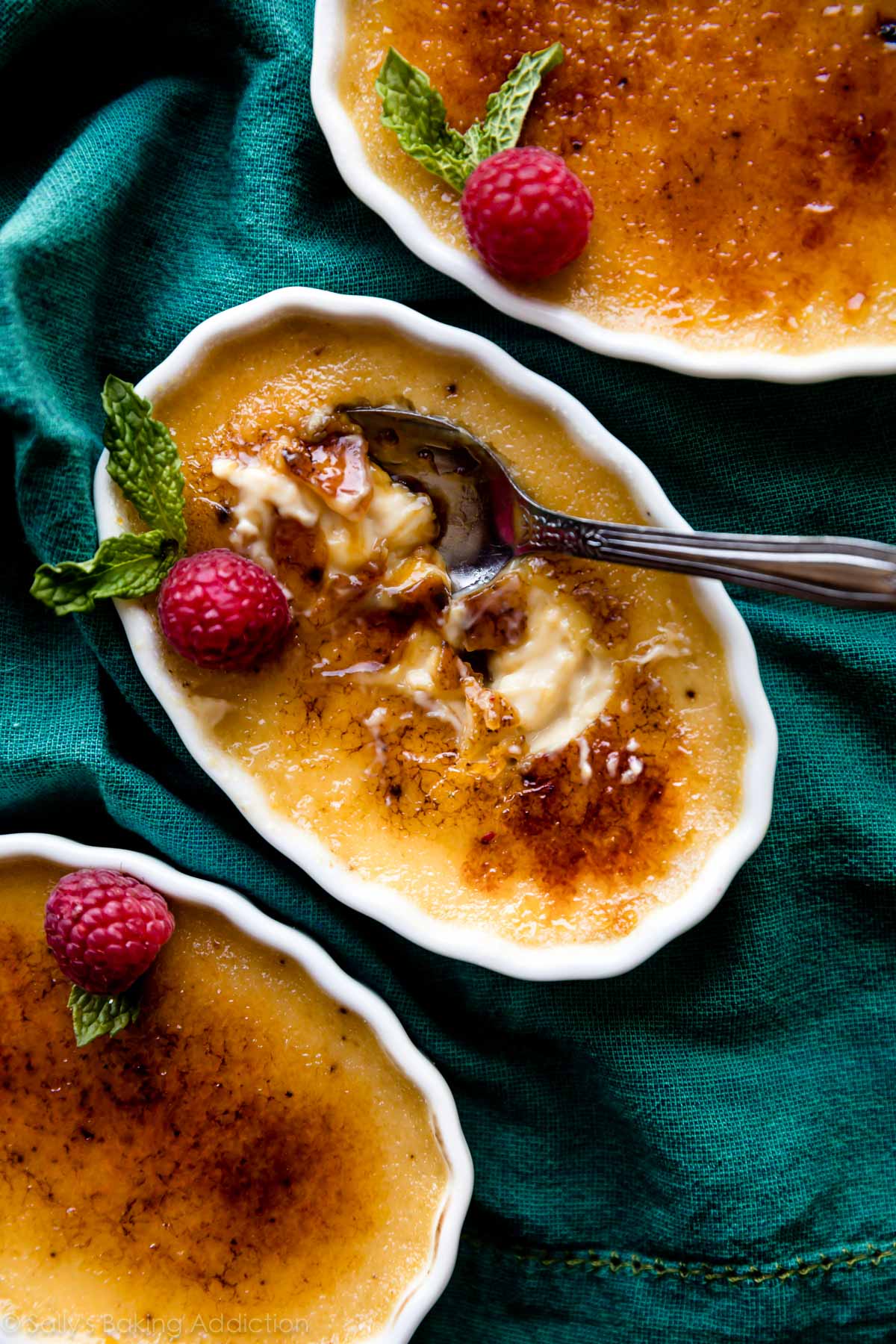 Homemade creme brûlée with a spoon