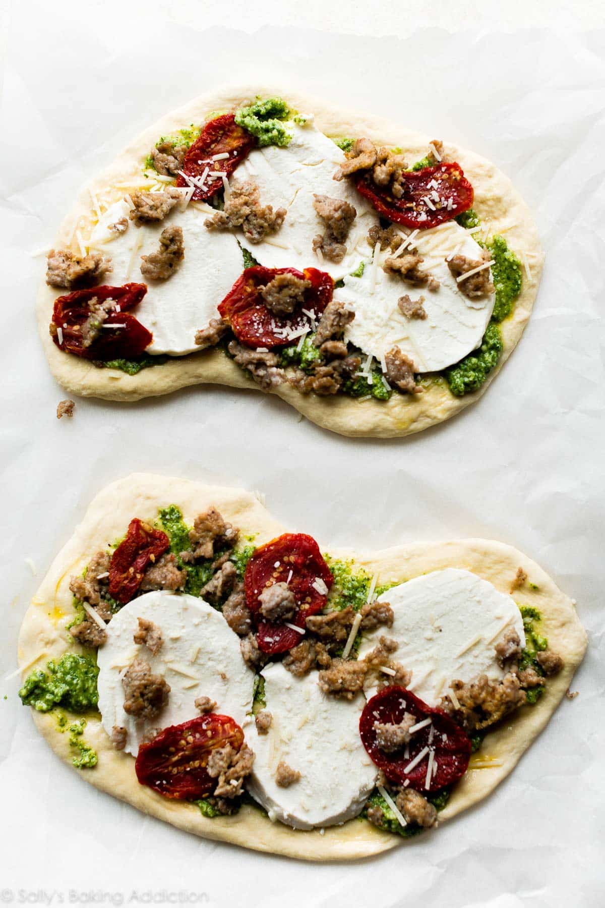 sausage and garlic pesto flatbread before baking