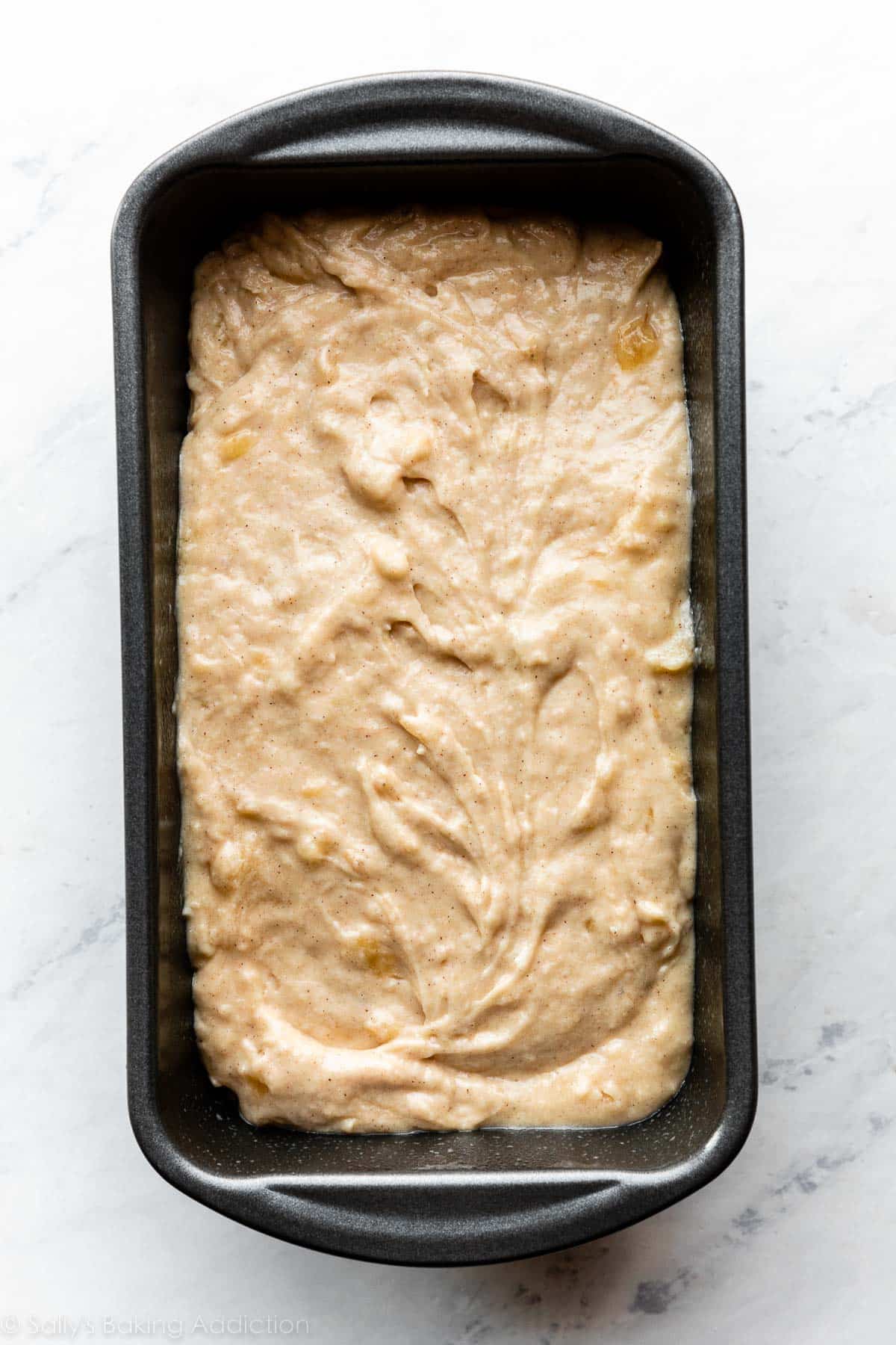 banana batter in metal loaf pan.