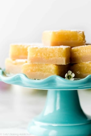 Lemon bars on teal cake stand