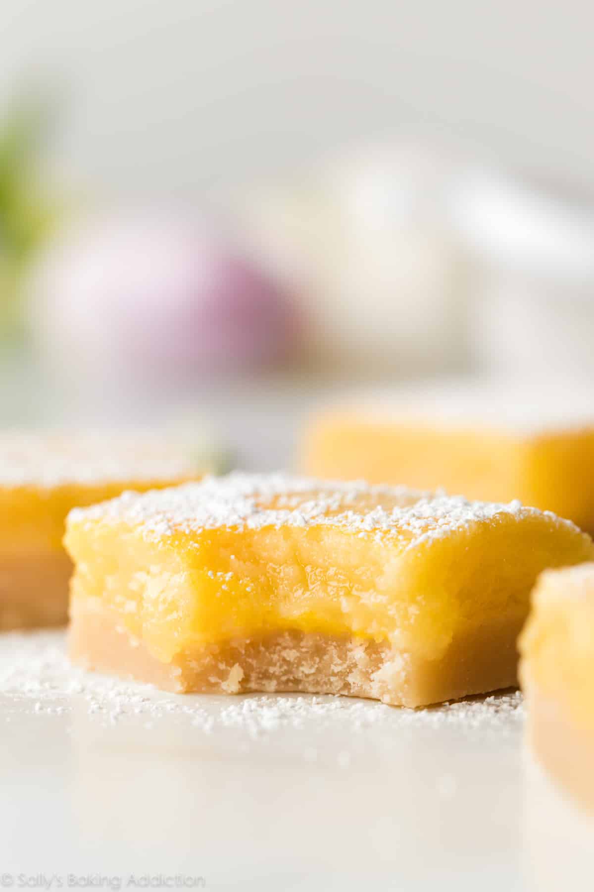 Lemon bar with a bite taken out of it