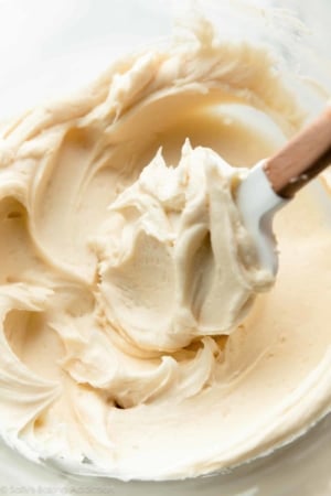 Champagne frosting in glass bowl with spatula