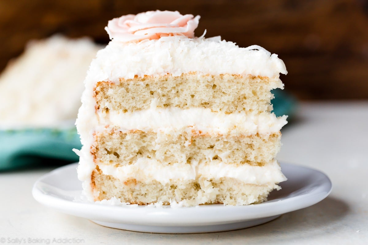 Coconut cake slice on white plate