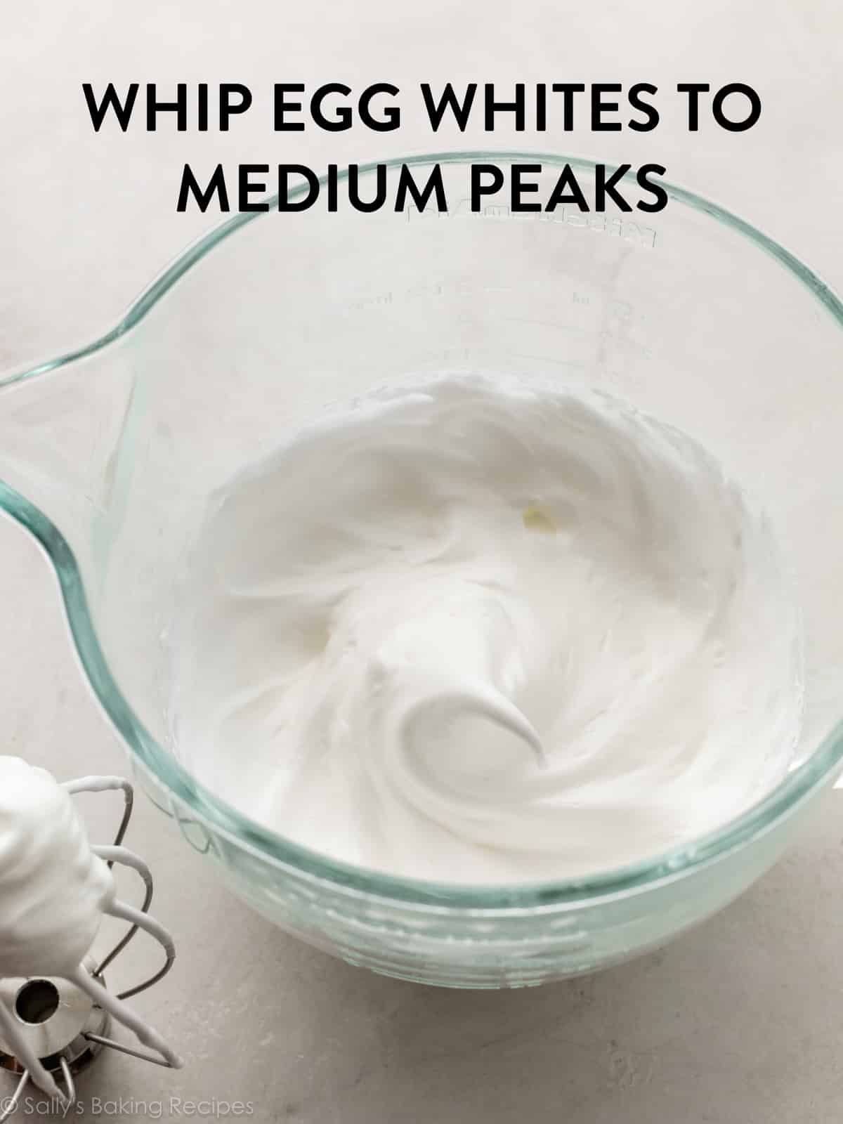 egg whites whipped into medium peaks in glass bowl.