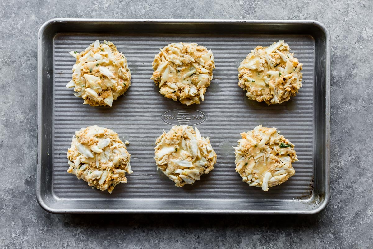 crab cakes on baking sheet