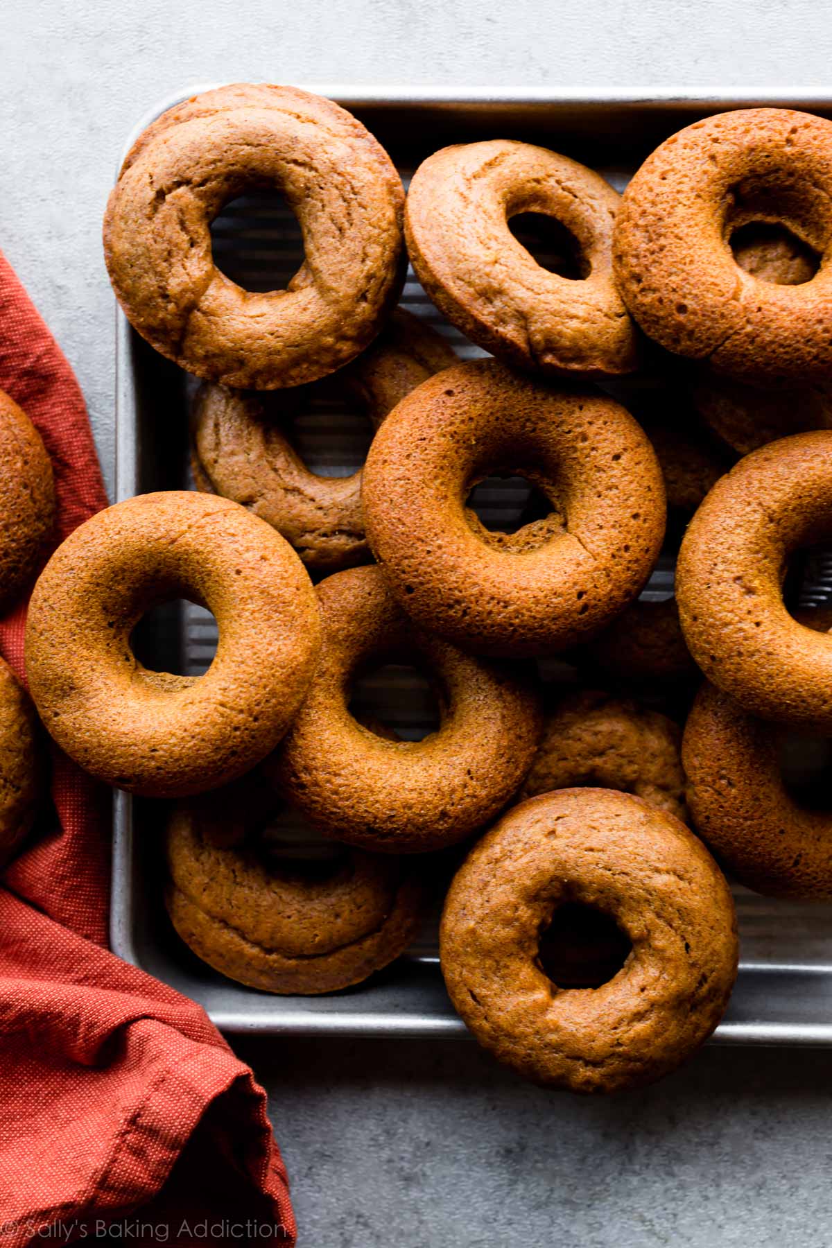 pumpkin donuts on a baking sheet