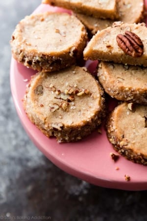 pecan shortbread cookies on a pink cake stand