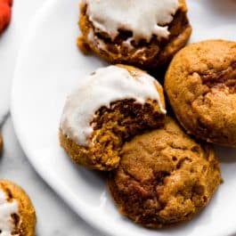 pumpkin cookies with icing on top