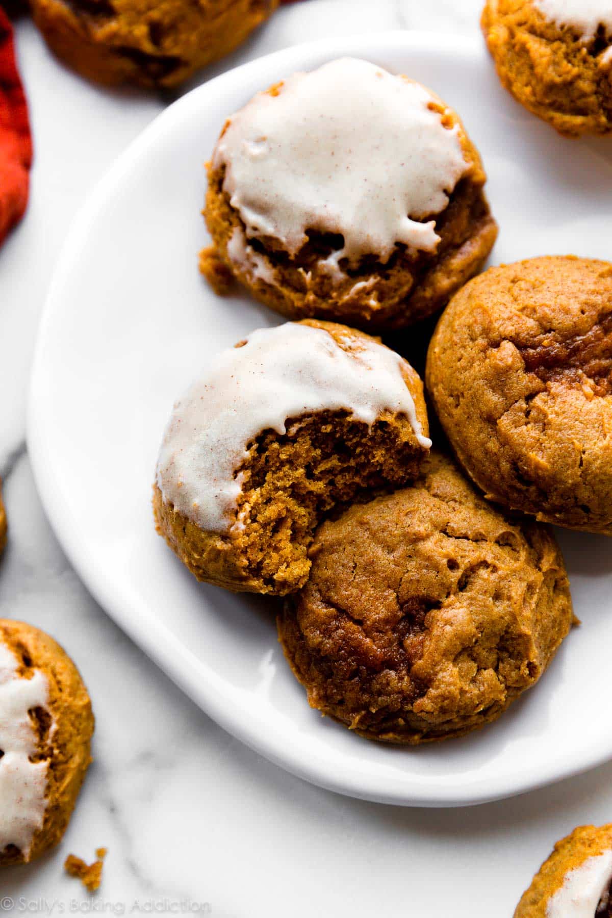 pumpkin cookies with icing on top