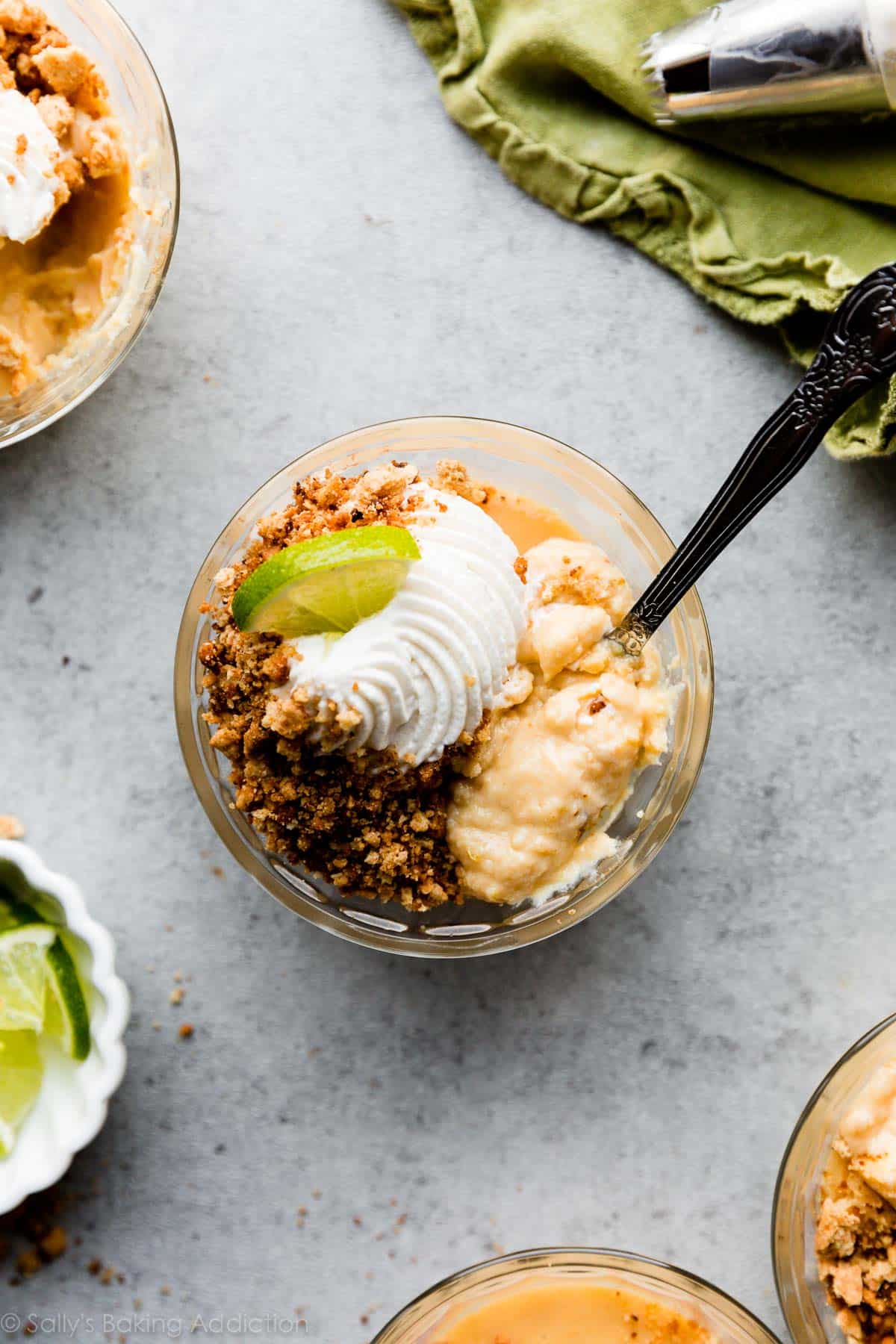 individual key lime pie with whipped cream on top in a custard cup