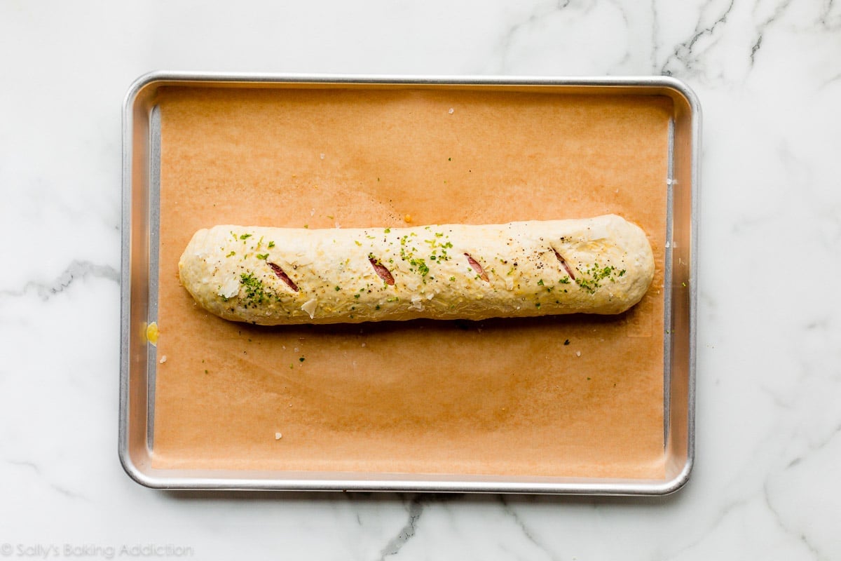 stromboli on baking sheet before baking