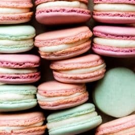 pink, purple, and aqua blue French macarons