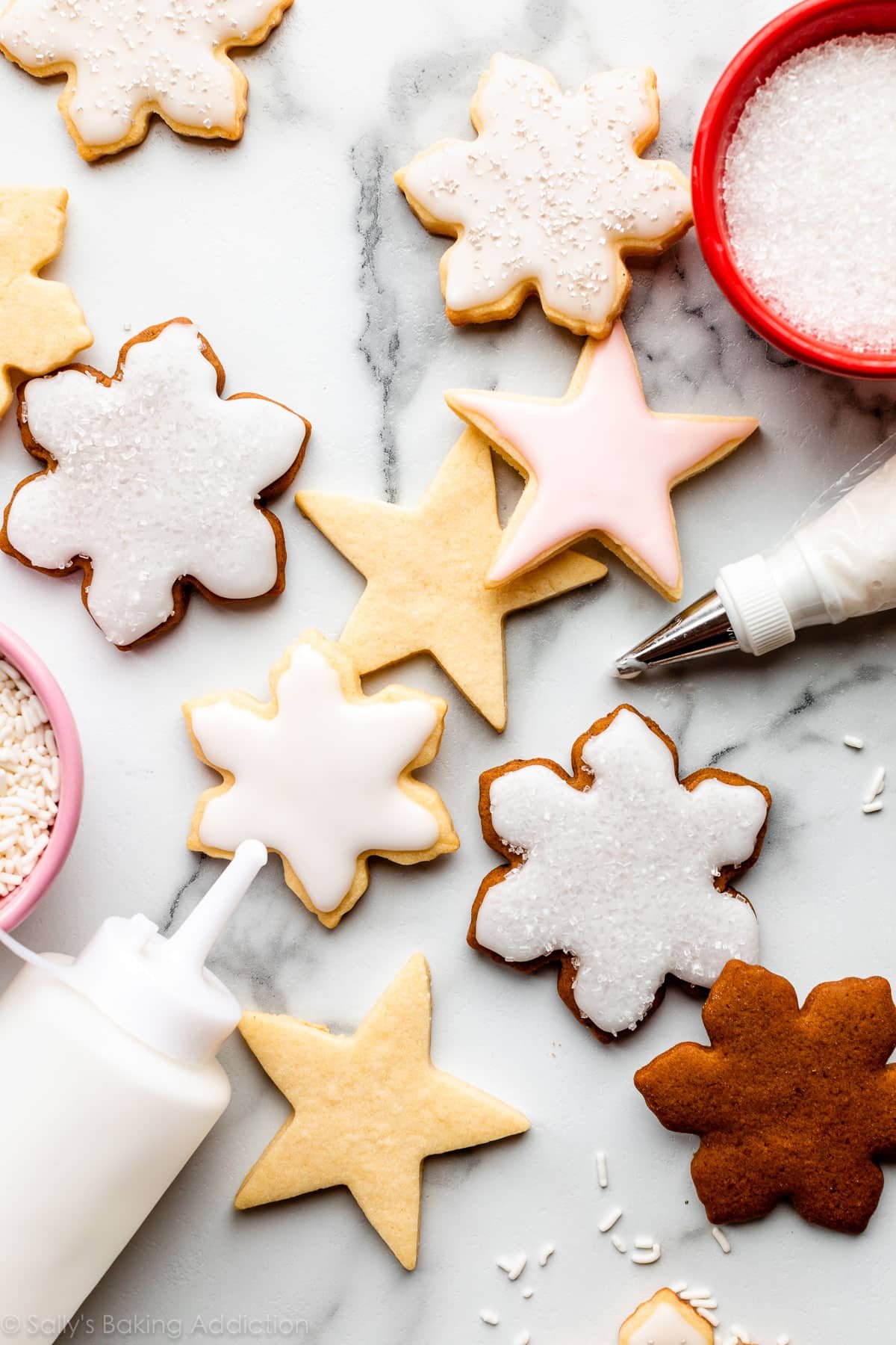 gingerbread cookies and sugar cookies decorated with icing