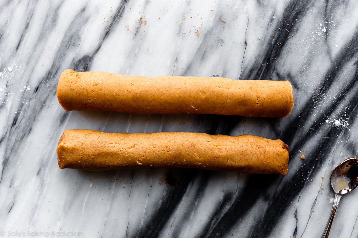 2 pumpkin roll cookie dough logs before chilling