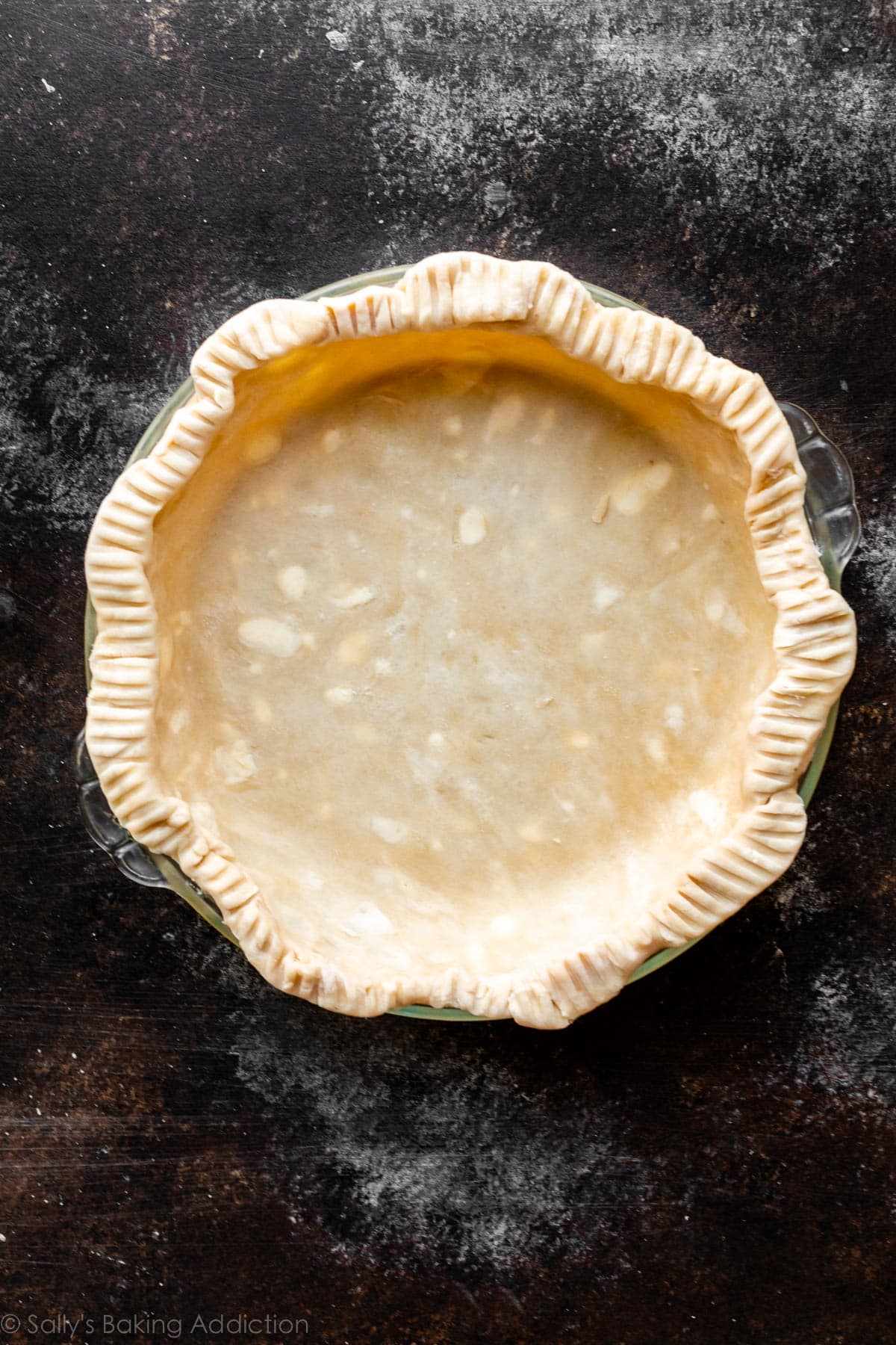 pie dough fluted and crimped in pie dish