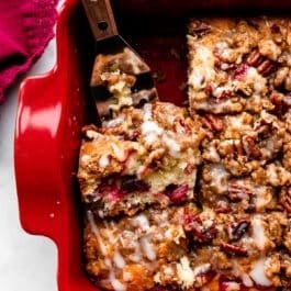 cranberry pecan crumb cake in red baking dish