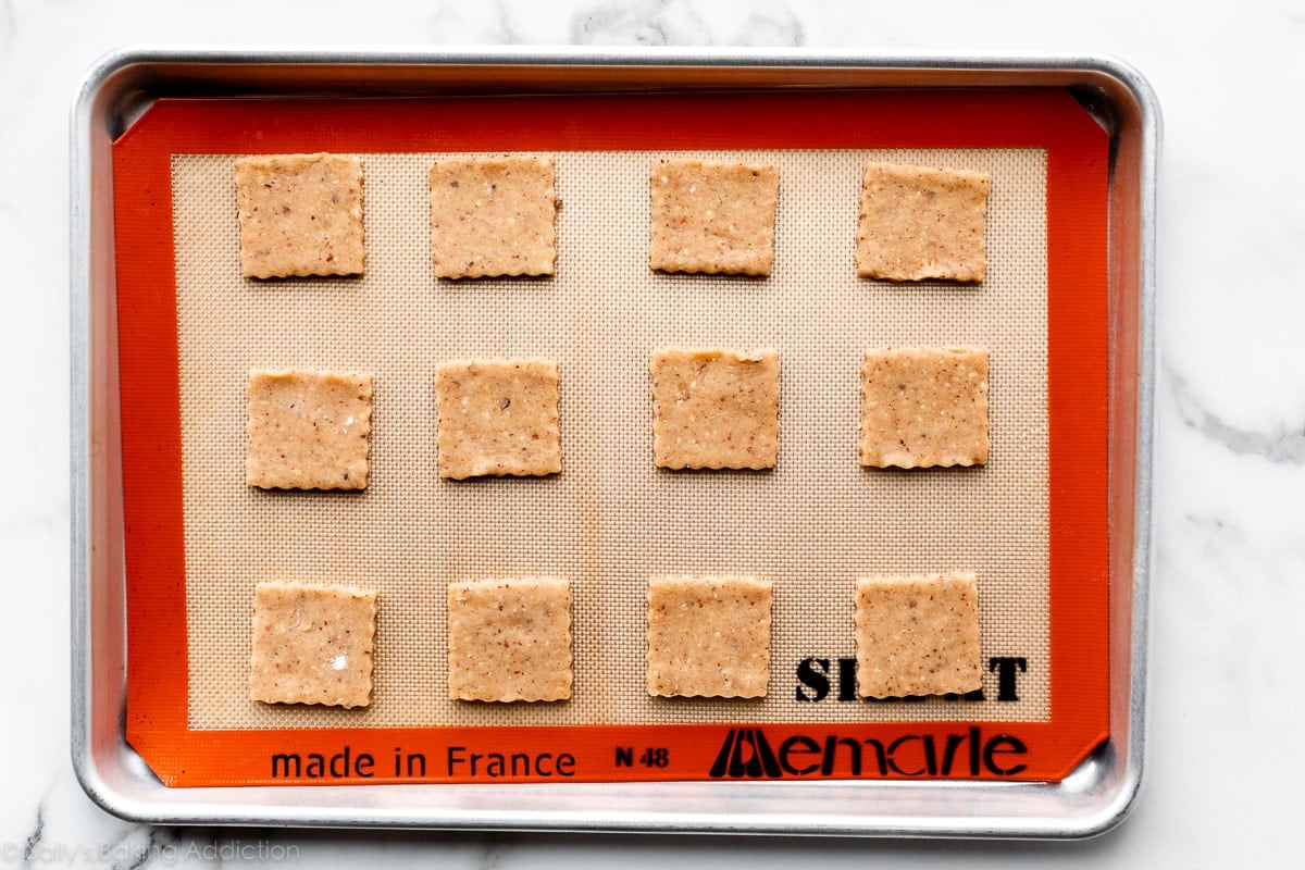 square hazelnut cookie dough arranged on a baking sheet