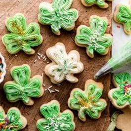 shamrock sugar cookies with green and white buttercream frosting