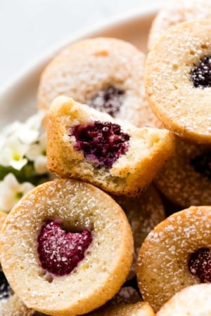 brown butter berry tea cake with bite taken out to show center