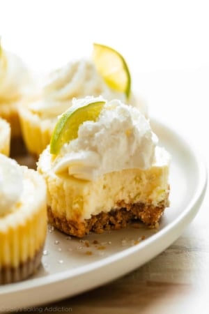 mini margarita cheesecakes with tequila whipped cream.