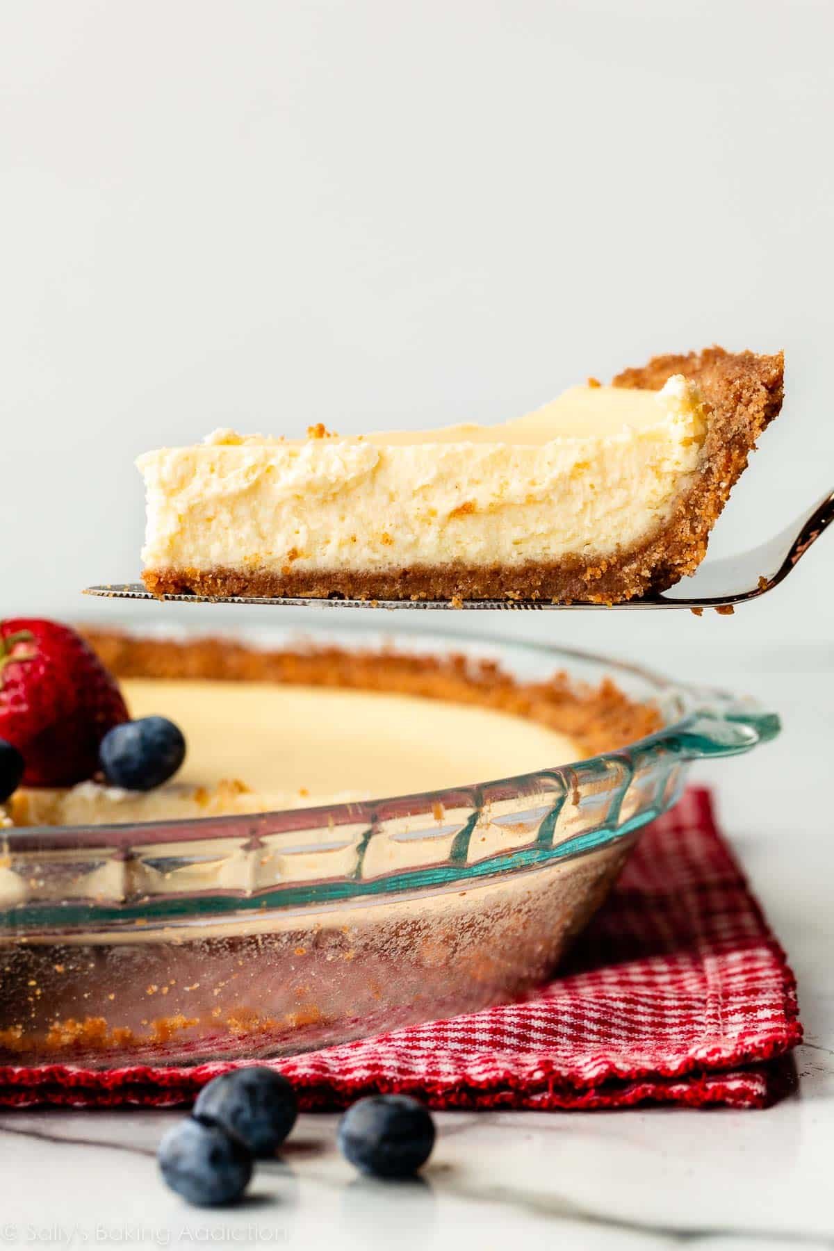 slice of cheesecake pie with graham cracker crust.