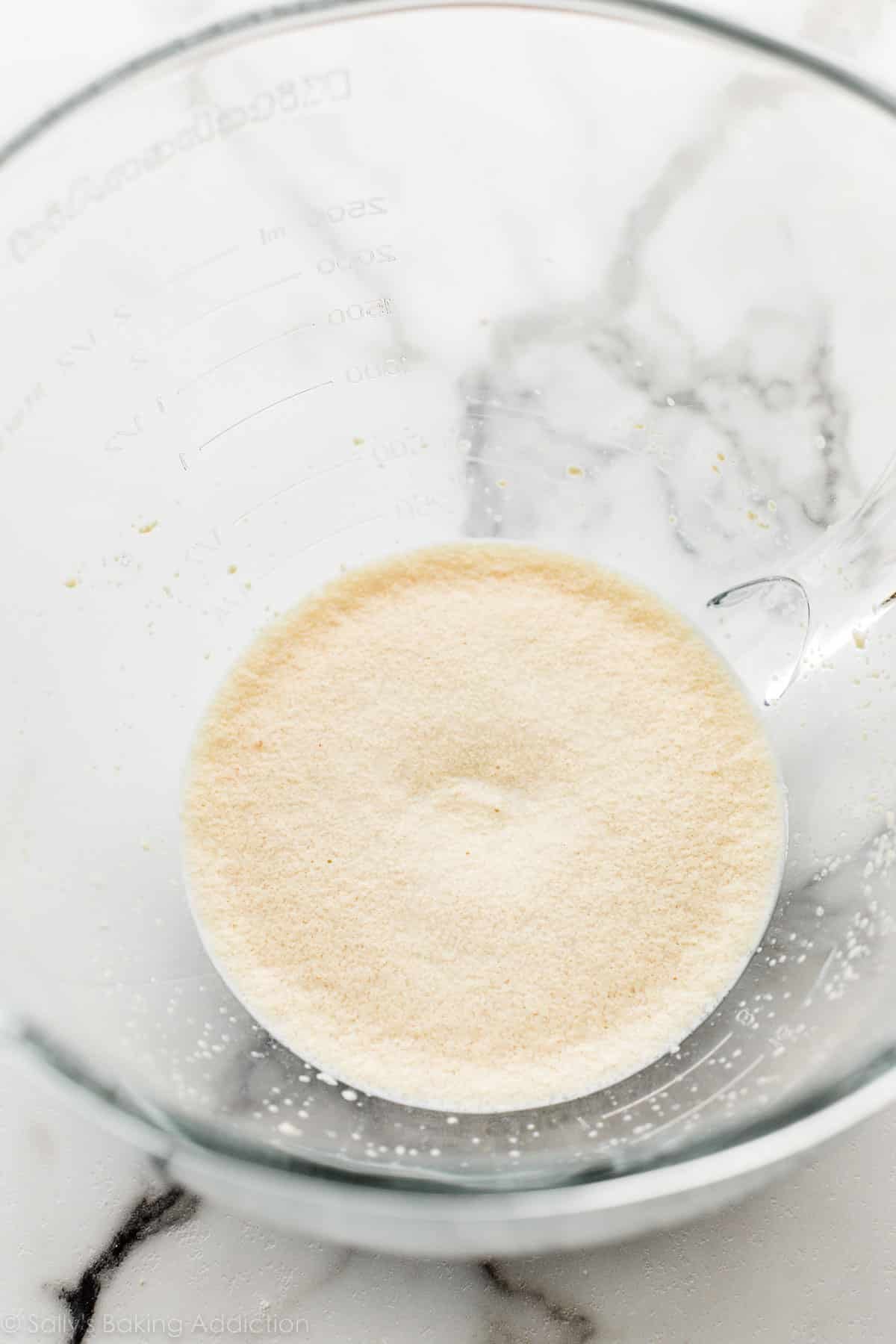 proofed yeast mixture in glass bowl.