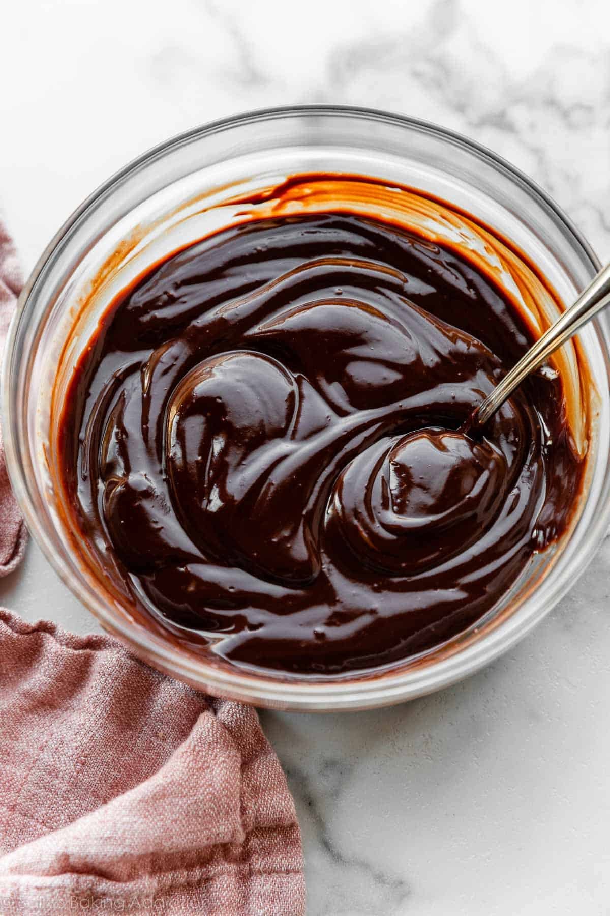 thickened chocolate ganache in glass bowl.