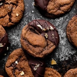 chocolate ginger molasses cookies dipped in dark chocolate and sprinkled with chopped crystallized ginger.