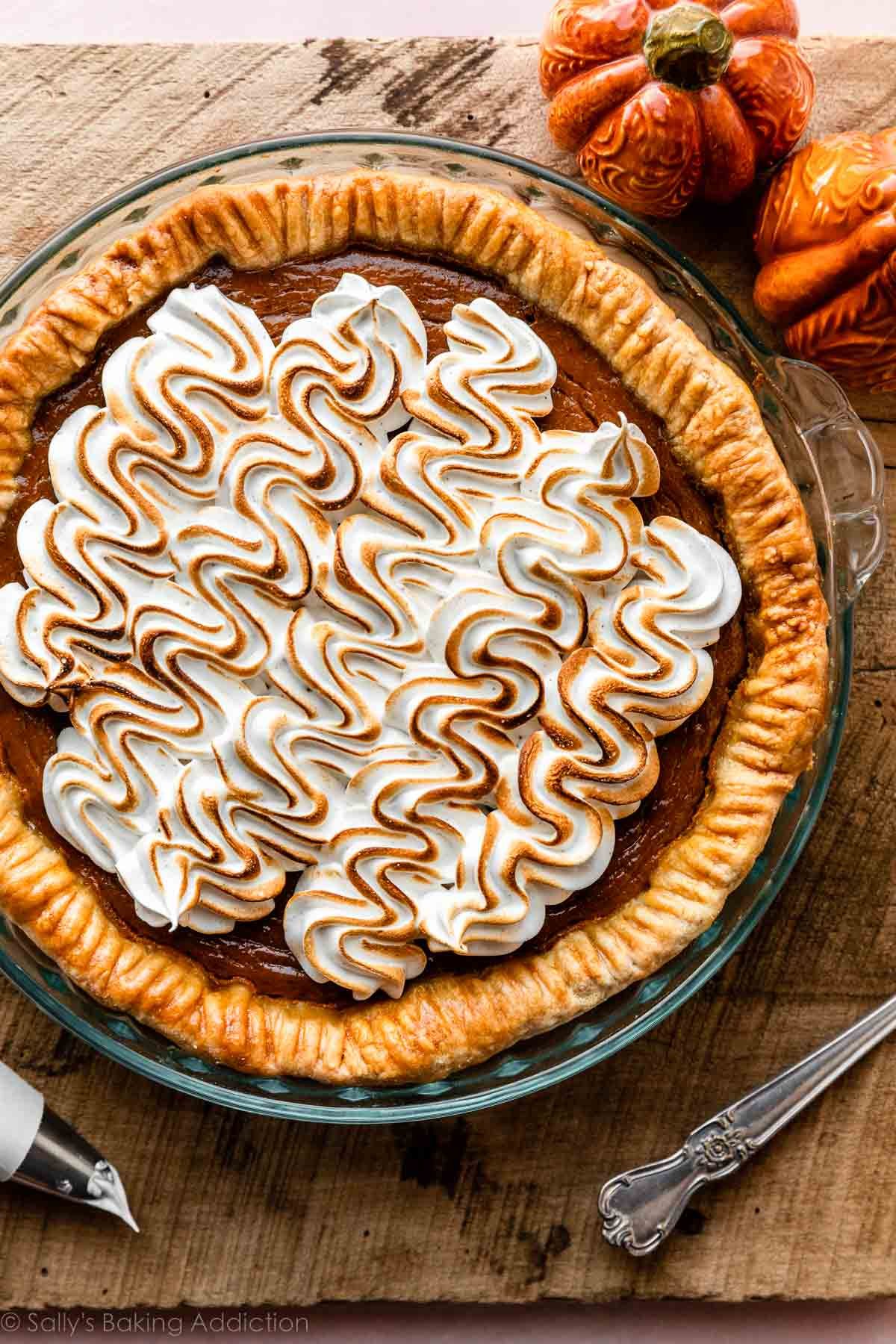 pumpkin pie with piped and toasted meringue topping.